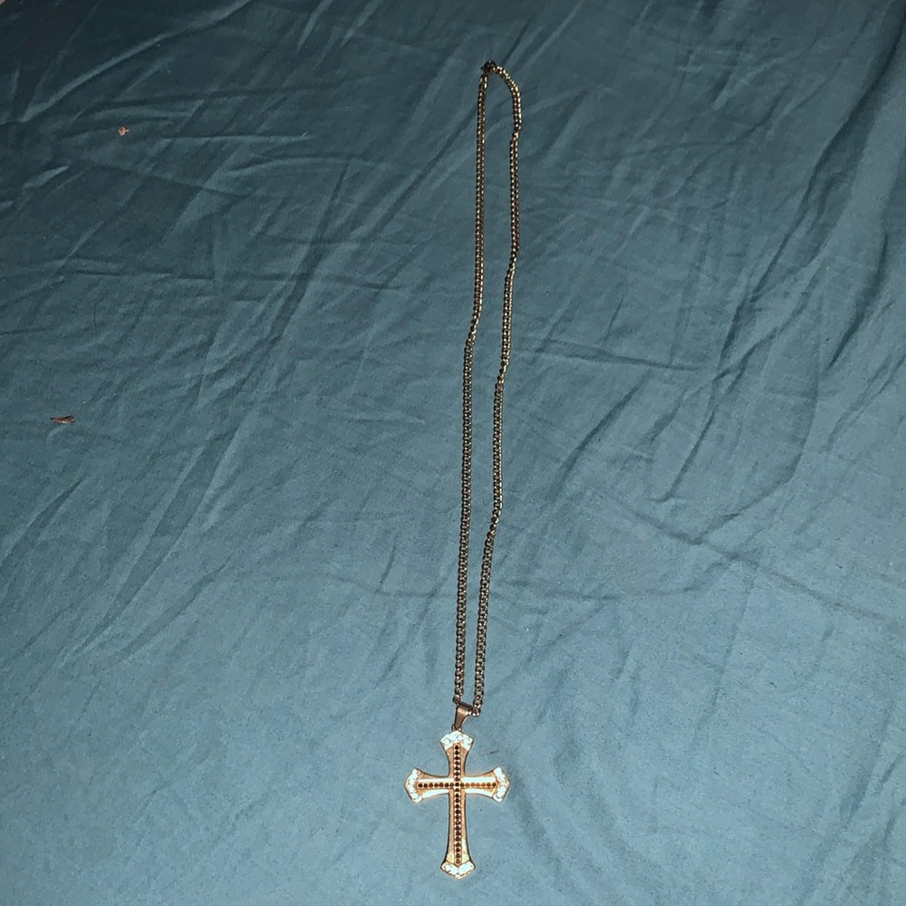 I am selling a gold cross necklace